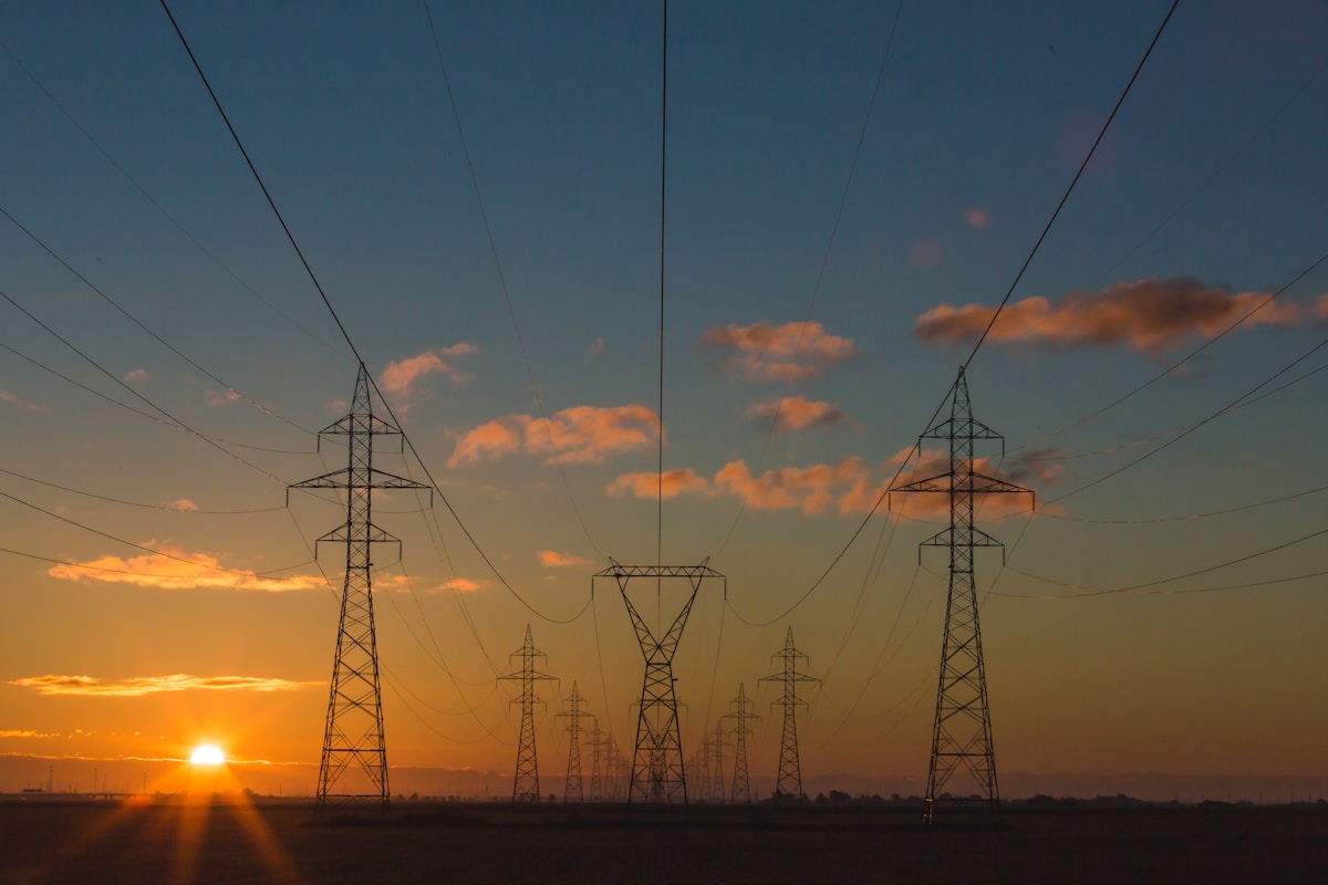 Industrial power transmission infrastructure at twilight